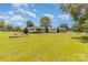 Well-maintained home featuring a large front yard with mature trees, providing a peaceful setting at 7430 Forney Hill Rd, Denver, NC 28037