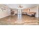 A spacious living room has wood flooring and views to the outside at 7430 Forney Hill Rd, Denver, NC 28037