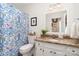 Bathroom featuring a vanity with granite countertop and a shower with a floral shower curtain at 935 Trentle Ct, Charlotte, NC 28211