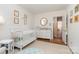Cozy Bedroom featuring a crib, changing table, and light-filled space at 935 Trentle Ct, Charlotte, NC 28211