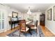 Formal dining room featuring a chandelier, hardwood floors, and classic design at 935 Trentle Ct, Charlotte, NC 28211
