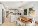 Open kitchen concept featuring white cabinets, eat-in nook, and stainless appliances at 935 Trentle Ct, Charlotte, NC 28211