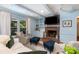 Cozy living room featuring a brick fireplace, hardwood floors and serene paint at 935 Trentle Ct, Charlotte, NC 28211