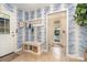 Charming mudroom featuring stylish wallpaper, bench with storage, and convenient coat hooks at 935 Trentle Ct, Charlotte, NC 28211