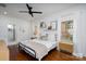 Comfortable bedroom features hardwood floors, a ceiling fan, and natural light from windows at 1008 Vanizer St, Charlotte, NC 28208