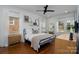 Comfortable bedroom features hardwood floors, a ceiling fan, and natural light from windows at 1008 Vanizer St, Charlotte, NC 28208