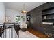 Charming Bedroom features a crib, plush chair, and custom built-in storage at 1008 Vanizer St, Charlotte, NC 28208