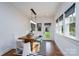 Bright dining area with built-in bench seating, modern lighting, and backyard access at 1008 Vanizer St, Charlotte, NC 28208