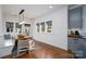 Bright dining area with built-in bench seating, modern lighting, and a view of outdoors at 1008 Vanizer St, Charlotte, NC 28208