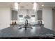 Close-up of kitchen featuring white subway tile backsplash and sleek stainless steel range hood at 1008 Vanizer St, Charlotte, NC 28208