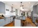 Open-concept kitchen with island flows into the living space, offering a seamless design at 1008 Vanizer St, Charlotte, NC 28208