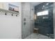 Custom tiled shower with glass enclosure and updated fixtures at 1008 Vanizer St, Charlotte, NC 28208