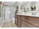 Bathroom with a dual sink vanity, shower and decorative ladder with plants at 103 Blackstone Ct # C, Statesville, NC 28677