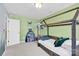 Bedroom featuring a wooden toddler bed, neutral walls and a colorful bookshelf at 103 Blackstone Ct # C, Statesville, NC 28677
