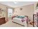 Cozy bedroom featuring a daybed with colorful pillows, dresser, and a window with blinds at 103 Blackstone Ct # C, Statesville, NC 28677