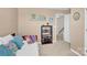Neutral bedroom featuring a bed with patterned pillows and an open door to the hallway at 103 Blackstone Ct # C, Statesville, NC 28677