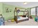 Bright bedroom with a wooden toddler bed with fence and stuffed animal accents at 103 Blackstone Ct # C, Statesville, NC 28677