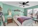 Bedroom features a white metal bed frame, neutral walls, and natural light from a window at 103 Blackstone Ct # C, Statesville, NC 28677