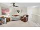Comfortable bonus room with ceiling fan, desk, loveseat, and plush chair at 103 Blackstone Ct # C, Statesville, NC 28677
