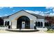 Elegant clubhouse with arched entrance, black shutters, and manicured landscaping offers community gathering space at 103 Blackstone Ct # C, Statesville, NC 28677