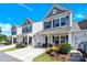 Street view of charming two-story homes with welcoming front porches and beautifully landscaped front yards at 103 Blackstone Ct # C, Statesville, NC 28677