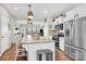 Open-concept kitchen with a large island, stainless steel appliances, and seamless flow to the living space at 103 Blackstone Ct # C, Statesville, NC 28677