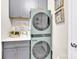 Modern laundry room with a stackable washer and dryer, countertop, and cabinets at 103 Blackstone Ct # C, Statesville, NC 28677