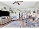 Open-concept living room with hardwood floors that connects to the kitchen and dining area at 103 Blackstone Ct # C, Statesville, NC 28677
