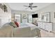 Bright main bedroom with large bed and dresser with a modern ceiling fan at 103 Blackstone Ct # C, Statesville, NC 28677