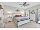 Calm bedroom with large white frame bed and matching dresser with cool toned decor at 103 Blackstone Ct # C, Statesville, NC 28677