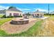Outdoor amenities including a fire pit, grill, and covered picnic area for community gatherings and enjoyment at 103 Blackstone Ct # C, Statesville, NC 28677