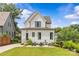 Back exterior featuring an outdoor patio and lush green grass at 113 Prince St, Belmont, NC 28012
