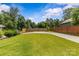 Expansive backyard featuring a well-maintained lawn and a wooden fence at 113 Prince St, Belmont, NC 28012