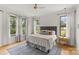 Bright bedroom with large windows and a soft color palette, creating a peaceful and inviting retreat at 113 Prince St, Belmont, NC 28012