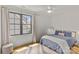 Bedroom with light hardwood floors, light walls, a modern ceiling fan, and a window with a view at 113 Prince St, Belmont, NC 28012