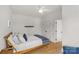 Bedroom featuring natural light, ceiling fan, hardwood floors, and a comfortable bed at 113 Prince St, Belmont, NC 28012