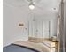 Bright bedroom with neutral walls, ceiling fan, and light hardwood floors at 113 Prince St, Belmont, NC 28012