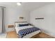 Cozy bedroom featuring natural light, hardwood floors, and a comfortable bed at 113 Prince St, Belmont, NC 28012