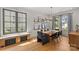 Modern dining room with large windows, stylish lighting, and a view of the backyard at 113 Prince St, Belmont, NC 28012