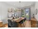 Elegant dining room with modern lighting, large windows, and a view of the front yard at 113 Prince St, Belmont, NC 28012