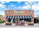 Charming antique mall exterior with brick facade, black awnings, and welcoming storefront displays at 113 Prince St, Belmont, NC 28012