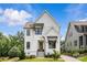 Charming two-story home featuring crisp white siding, black window trim, and a welcoming front porch at 113 Prince St, Belmont, NC 28012