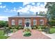 Exterior view of brick City Hall with manicured landscaping and blue sky background at 113 Prince St, Belmont, NC 28012