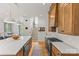 Well-lit kitchen with a large island, gas range, and ample storage space, perfect for culinary enthusiasts at 113 Prince St, Belmont, NC 28012