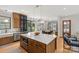 Open-concept kitchen with island provides seating and ample counter space for meal prep and casual dining at 113 Prince St, Belmont, NC 28012