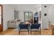 Bright living room with large windows, a fireplace, hardwood floors, and modern furnishings at 113 Prince St, Belmont, NC 28012
