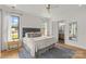 Bright main bedroom with natural light, ensuite bathroom, and stylish modern decor at 113 Prince St, Belmont, NC 28012