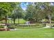 Scenic park featuring a circular fountain, walking paths, and green space at 113 Prince St, Belmont, NC 28012