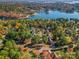 Beautiful aerial view of a lakeside home surrounded by colorful trees and waterfront views at 116 Ivy Hollow Ln, Mooresville, NC 28117