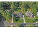 Aerial view of a stunning property with lush landscaping, expansive lawns, and mature trees at 116 Ivy Hollow Ln, Mooresville, NC 28117